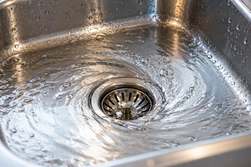Illustrative close-up of a kitchen sink drain